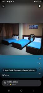 卡塔马约Hotel Dubái的一张酒店客房内的两张床的照片