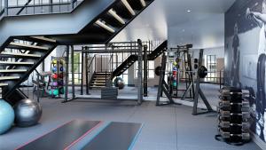 浦耳Contemporary, stylish south coast home的健身房设有设备和楼梯