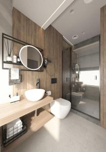 罗夫诺FULL HOUSE apart hotel的一间带水槽、卫生间和镜子的浴室
