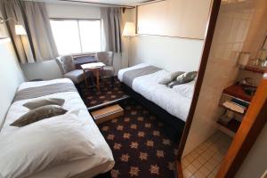 Fairtours Hotelschiff Rex Rheni ***客房内的一张或多张床位