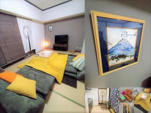 东京板橋 RCアネックス Rc306的一间设有一张床的客房,享有山脉美景
