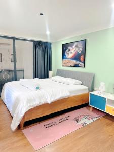 邦美蜀Gachilly House - Your Cozy Home In The Heart Of The BMT City的一间卧室,卧室内配有一张大床