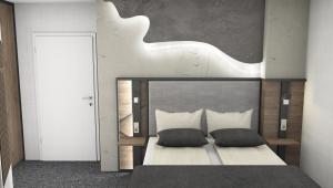 瓦伦莱斯克乐瓦伦酒店的一间卧室配有一张带两个枕头的床