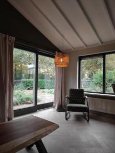 Luxe familiehuis 8p nabij bos en hei op de Veluwe的休息区