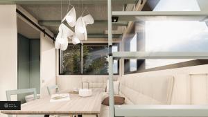 BuryMiniBora Le marin - Cantons-de-l'Est的一间带桌子和窗户的用餐室