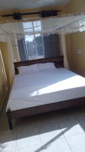 Nyali cozy home客房内的一张或多张床位