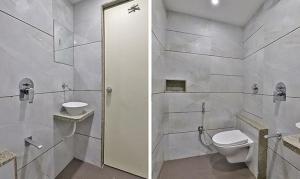 苏拉特FabHotel Prime Legend的白色的浴室设有卫生间和水槽。