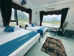 Nguyên NgoạiNice homestay in Ninh Binh的河景卧室 - 带2张床