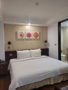 Hanoi Dragon Boutique Hotel客房内的一张或多张床位