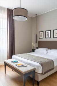 Flom Boutique Hotel客房内的一张或多张床位