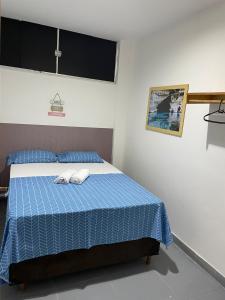 Pousada hostel praia itapua客房内的一张或多张床位