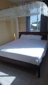 Nyali cozy home客房内的一张或多张床位