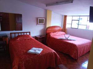 Hostal Cusco Inn客房内的一张或多张床位