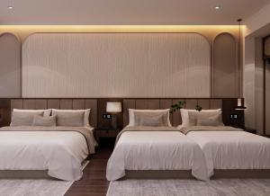 河内L'amant de Hanoi Hotel - khách sạn Lamant de Hà Nội的酒店的客房 - 带2张带白色枕头的床