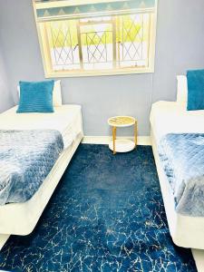Monaco villa Gaborone客房内的一张或多张床位