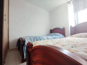 Hermoso Apartamento Estancia Tranquila por dias, semanas o meses客房内的一张或多张床位