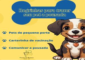 奥林匹亚Pousada das Bandeiras的一张照片,上面写着“飞鹰号”字的狗把小狗从小狗身上转移。