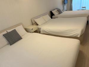 Maison L Motobu客房内的一张或多张床位