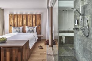 特洛普拉赫福肯斯坦卡琳兹亚酒店 的一间卧室配有一张床和淋浴