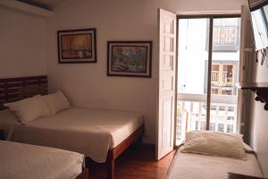 Hotel Raíces Casona Real客房内的一张或多张床位