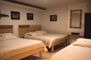 Hotel Raíces Casona Real客房内的一张或多张床位