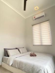 Homestay Sekinchan with Private Pool - Mslim0nly客房内的一张或多张床位