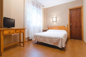 阿尔塞亚米拉多尔德卡布拉雷斯酒店客房内的一张或多张床位