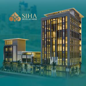 西哈努克SIHA Hotel & Casino的一座酒店和赌场的建筑 ⁇ 染
