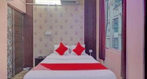 OYO Hotel Swarna Palace客房内的一张或多张床位