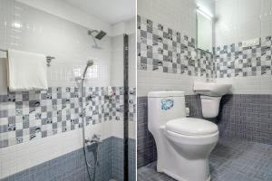 蒙纳FabHotel Abrigo Residency的一间带卫生间和淋浴的浴室