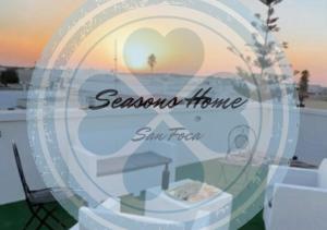 新福卡Seasons Home San Foca的显示四季回家的窗口标志