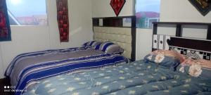 普诺casa ecológica的卧室内两张并排的床