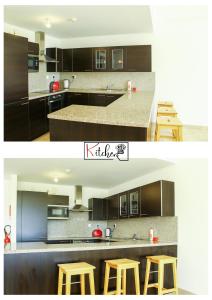 希法Sifah-Wateera Property Management Marina Apartments的一间厨房,里面装有棕色橱柜和三把凳子