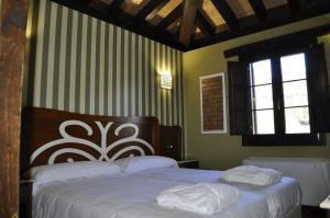 Hotel Rural El Reundu客房内的一张或多张床位