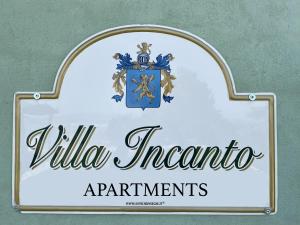 特雷伊索Villa Incanto Apartments的别墅坎塔托公寓的标志
