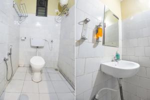 马尔冈FabExpress Sunrise By Vihasta的白色的浴室设有卫生间和水槽。