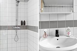 斯德哥尔摩斯德哥尔摩阿尔维克弗里农公寓式酒店的带淋浴和盥洗盆的浴室