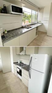 埃斯佩兰萨Alquiler temporario a estrenar的厨房配有白色橱柜和白色冰箱。