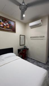 西子楼 CZI Budget Hotel Sungai Siput客房内的一张或多张床位