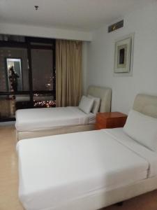 BBS APARTMENT AT TIMES SQUARE KUALA LUMPUR MALAYSIA客房内的一张或多张床位