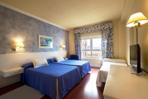瓜达尔基维尔酒店客房内的一张或多张床位