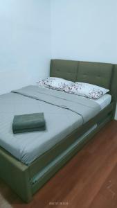 Laman Hanaz - Homestay Auni客房内的一张或多张床位