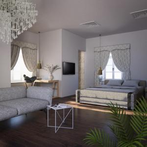 马斯林尼察马提尼马奇赫利塔奇酒店的一间卧室配有一张床、一张沙发和一台电视。