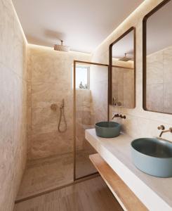 赫索尼索斯罗福思公寓酒店的一间带两个盥洗盆和淋浴的浴室