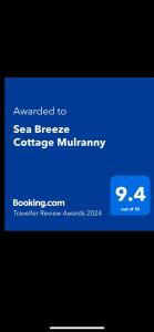 穆尔兰尼Sea Breeze Cottage Mulranny的手机的屏幕,文字升级为海风小屋