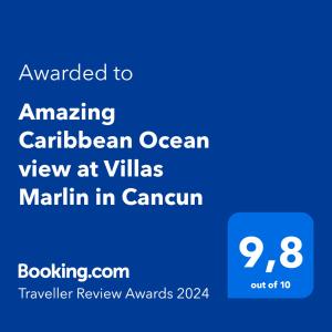 坎昆Amazing Caribbean Ocean view at Villas Marlin in Cancun的一部手机的屏幕,上面有文字,在村庄里欣赏加勒比海的景色
