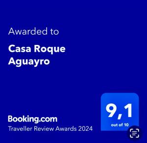 阿古伊梅斯Casa Roque Aguayro的蓝色的屏幕,上面的文字被授予casa rogue aquarius