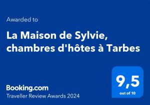 塔布La Maison de Sylvie, chambres d'hôtes à Tarbes的带有注射冠军的使命的蓝色标志