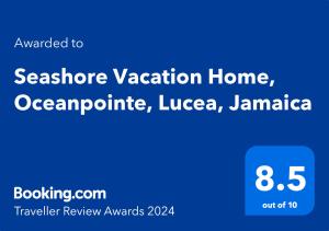 PointSeashore Vacation Home, Oceanpointe, Lucea, Jamaica的手机的屏幕,带单词的度假屋