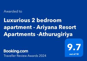 科伦坡Luxurious 2 bedroom apartment - Ariyana Resort Apartments -Athurugiriya的手机的屏幕,文字升级到明亮的卧室公寓